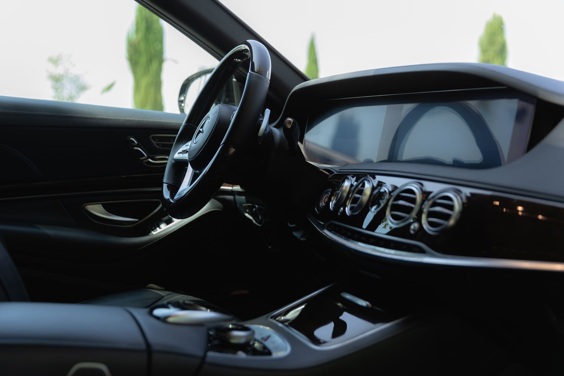 Clean Mercedes luxury interior with polished controls and leather surfaces